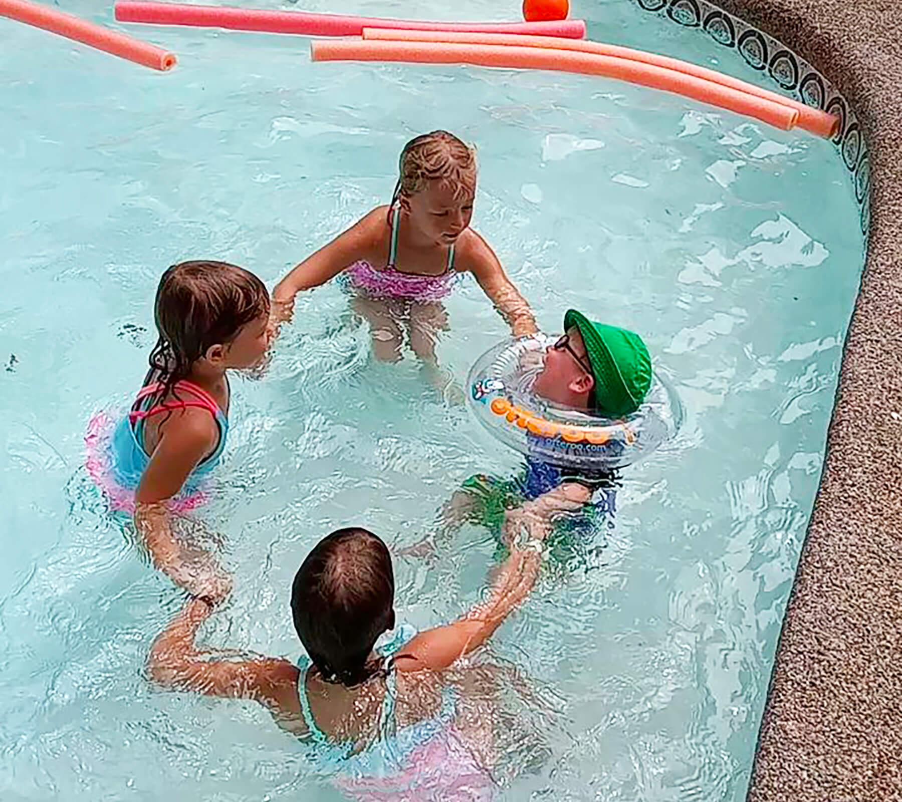 Toddler with Cerebral Palsy Loves to Play in the Pool
