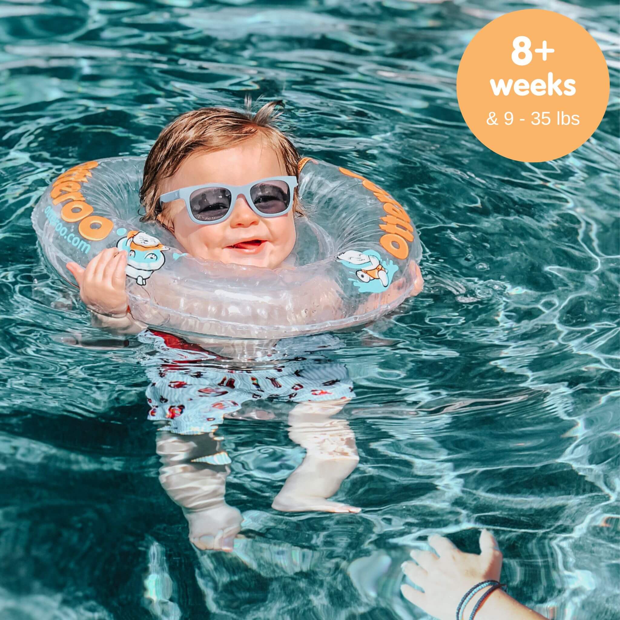 baby boy wearing Otteroo baby neck float in pool
